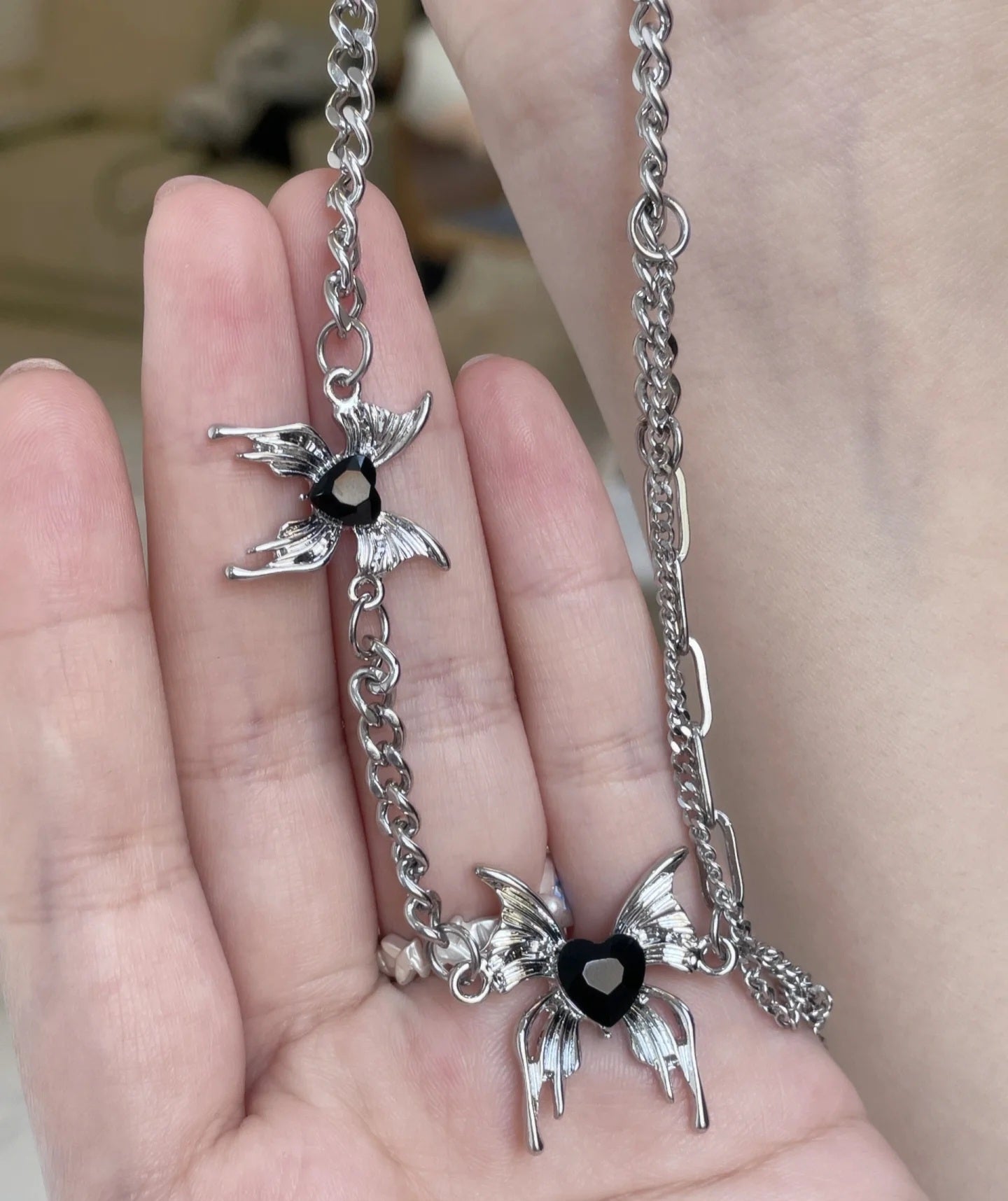 Black heart butterfly necklace