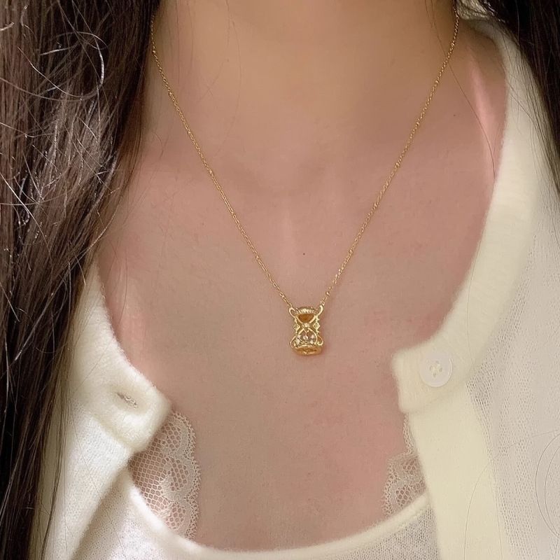 Gold hourglass necklace